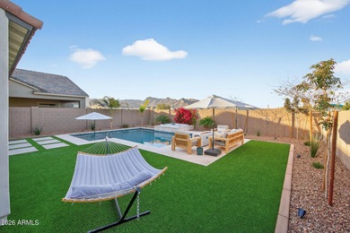 Pool home with a spa & panoramic views of the White Tank on Verrado Golf Club  in Arizona - for sale on GolfHomes.com, golf home, golf lot