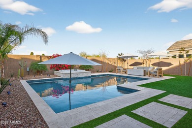 Pool home with a spa & panoramic views of the White Tank on Verrado Golf Club  in Arizona - for sale on GolfHomes.com, golf home, golf lot