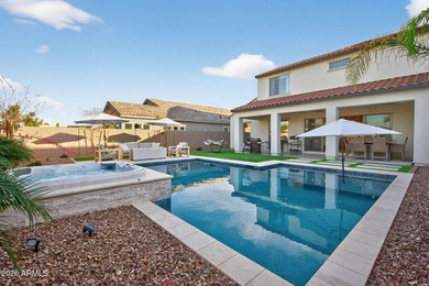 Pool home with a spa & panoramic views of the White Tank on Verrado Golf Club  in Arizona - for sale on GolfHomes.com, golf home, golf lot