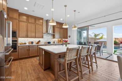 Pool home with a spa & panoramic views of the White Tank on Verrado Golf Club  in Arizona - for sale on GolfHomes.com, golf home, golf lot