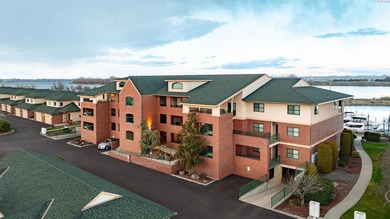 Experience luxury living with breathtaking waterfront vistas in on Columbia Point Golf Course in Washington - for sale on GolfHomes.com, golf home, golf lot