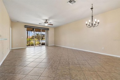 This lovely home is located just steps away from the Valencia on Caloosa Greens Executive Golf Course in Florida - for sale on GolfHomes.com, golf home, golf lot