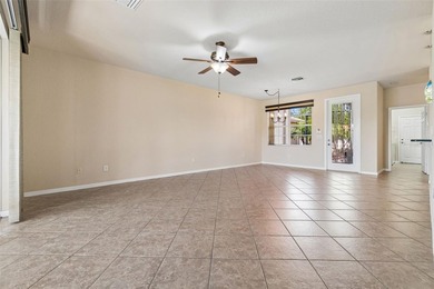 This lovely home is located just steps away from the Valencia on Caloosa Greens Executive Golf Course in Florida - for sale on GolfHomes.com, golf home, golf lot