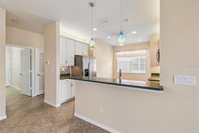 This lovely home is located just steps away from the Valencia on Caloosa Greens Executive Golf Course in Florida - for sale on GolfHomes.com, golf home, golf lot