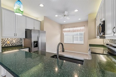 This lovely home is located just steps away from the Valencia on Caloosa Greens Executive Golf Course in Florida - for sale on GolfHomes.com, golf home, golf lot