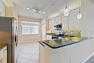 This lovely home is located just steps away from the Valencia on Caloosa Greens Executive Golf Course in Florida - for sale on GolfHomes.com, golf home, golf lot