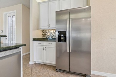 This lovely home is located just steps away from the Valencia on Caloosa Greens Executive Golf Course in Florida - for sale on GolfHomes.com, golf home, golf lot