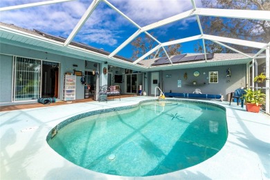 This custom-built, 4-bedroom, solar, waterfront home with a pool on Port Charlotte Golf Club in Florida - for sale on GolfHomes.com, golf home, golf lot