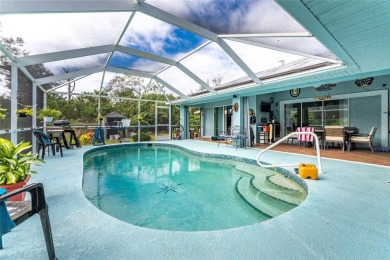 This custom-built, 4-bedroom, solar, waterfront home with a pool on Port Charlotte Golf Club in Florida - for sale on GolfHomes.com, golf home, golf lot