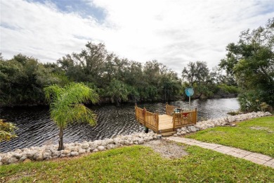 This custom-built, 4-bedroom, solar, waterfront home with a pool on Port Charlotte Golf Club in Florida - for sale on GolfHomes.com, golf home, golf lot