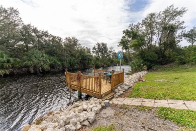 This custom-built, 4-bedroom, solar, waterfront home with a pool on Port Charlotte Golf Club in Florida - for sale on GolfHomes.com, golf home, golf lot