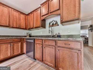 **BEST DEAL IN TOWN!!** Nestled in a serene lake community, this on The Highlands Course at Lake Arrowhead in Georgia - for sale on GolfHomes.com, golf home, golf lot