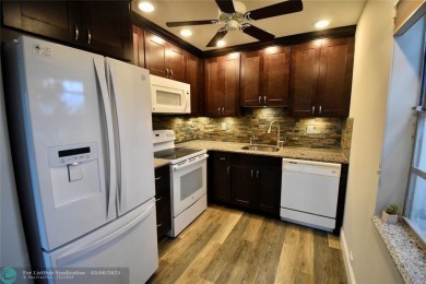 Beautifully updated, 2/2 first floor corner unit condo in King's on  in Florida - for sale on GolfHomes.com, golf home, golf lot