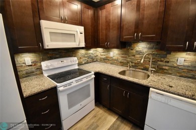 Beautifully updated, 2/2 first floor corner unit condo in King's on  in Florida - for sale on GolfHomes.com, golf home, golf lot
