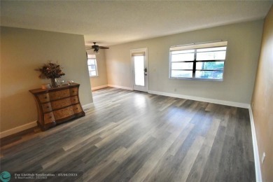 Beautifully updated, 2/2 first floor corner unit condo in King's on  in Florida - for sale on GolfHomes.com, golf home, golf lot