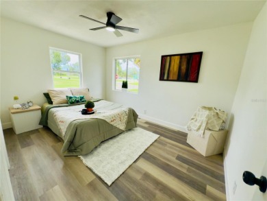 Nestled in the tranquil Edgemoor Estates neighborhood, this cozy on Mangrove Bay Golf Course in Florida - for sale on GolfHomes.com, golf home, golf lot
