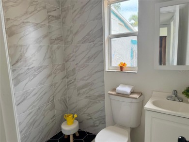 Nestled in the tranquil Edgemoor Estates neighborhood, this cozy on Mangrove Bay Golf Course in Florida - for sale on GolfHomes.com, golf home, golf lot
