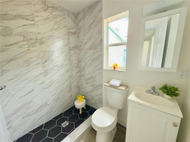Nestled in the tranquil Edgemoor Estates neighborhood, this cozy on Mangrove Bay Golf Course in Florida - for sale on GolfHomes.com, golf home, golf lot