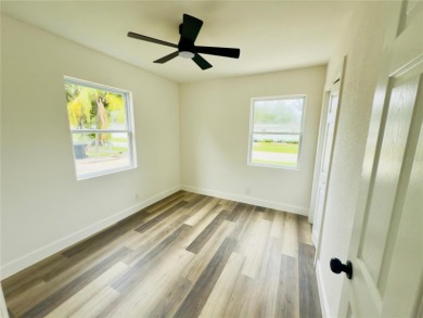 Nestled in the tranquil Edgemoor Estates neighborhood, this cozy on Mangrove Bay Golf Course in Florida - for sale on GolfHomes.com, golf home, golf lot