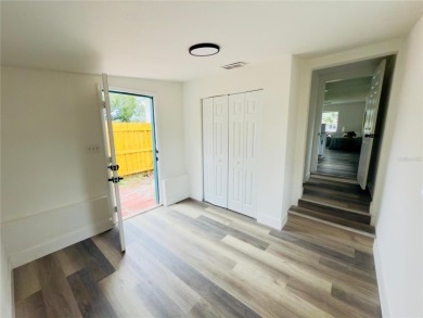Nestled in the tranquil Edgemoor Estates neighborhood, this cozy on Mangrove Bay Golf Course in Florida - for sale on GolfHomes.com, golf home, golf lot
