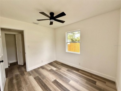 Nestled in the tranquil Edgemoor Estates neighborhood, this cozy on Mangrove Bay Golf Course in Florida - for sale on GolfHomes.com, golf home, golf lot