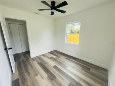Nestled in the tranquil Edgemoor Estates neighborhood, this cozy on Mangrove Bay Golf Course in Florida - for sale on GolfHomes.com, golf home, golf lot