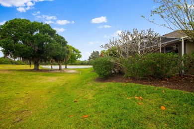 Nestled in the heart of Viera East Golf Course, this villa on Viera East Golf Club in Florida - for sale on GolfHomes.com, golf home, golf lot