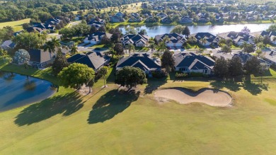 Nestled in the heart of Viera East Golf Course, this villa on Viera East Golf Club in Florida - for sale on GolfHomes.com, golf home, golf lot