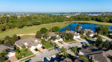 Nestled in the heart of Viera East Golf Course, this villa on Viera East Golf Club in Florida - for sale on GolfHomes.com, golf home, golf lot