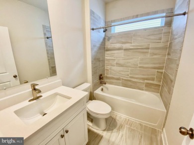 MOVE IN READY-FINISHED BASEMENT AND UPPER LEVEL!  Photos are of on Plantation Lakes Golf and Country Club in Delaware - for sale on GolfHomes.com, golf home, golf lot