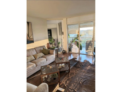 Live in elegance in this beautifully remodeled home in a gated on Inverrary Country Club in Florida - for sale on GolfHomes.com, golf home, golf lot