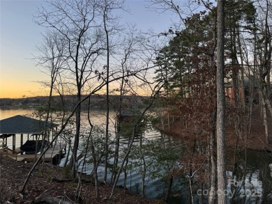 This exceptional waterfront property on Lake Tillery offers on The Tillery Tradition Country Club in North Carolina - for sale on GolfHomes.com, golf home, golf lot