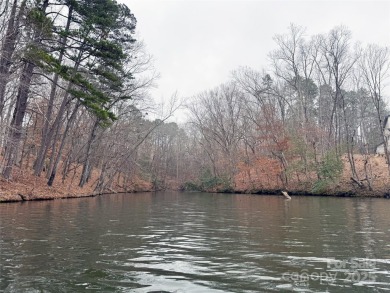 This exceptional waterfront property on Lake Tillery offers on The Tillery Tradition Country Club in North Carolina - for sale on GolfHomes.com, golf home, golf lot