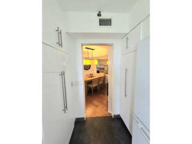Live in elegance in this beautifully remodeled home in a gated on Inverrary Country Club in Florida - for sale on GolfHomes.com, golf home, golf lot