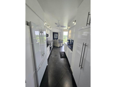 Live in elegance in this beautifully remodeled home in a gated on Inverrary Country Club in Florida - for sale on GolfHomes.com, golf home, golf lot