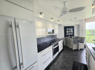 Live in elegance in this beautifully remodeled home in a gated on Inverrary Country Club in Florida - for sale on GolfHomes.com, golf home, golf lot