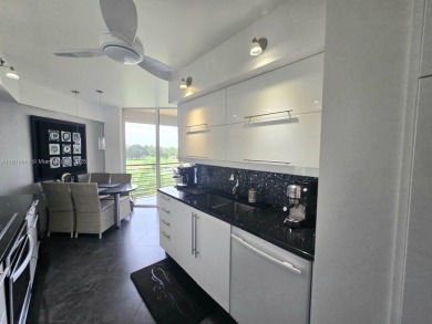 Live in elegance in this beautifully remodeled home in a gated on Inverrary Country Club in Florida - for sale on GolfHomes.com, golf home, golf lot