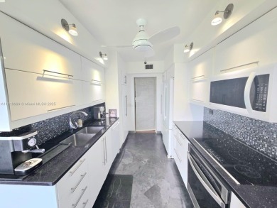 Live in elegance in this beautifully remodeled home in a gated on Inverrary Country Club in Florida - for sale on GolfHomes.com, golf home, golf lot