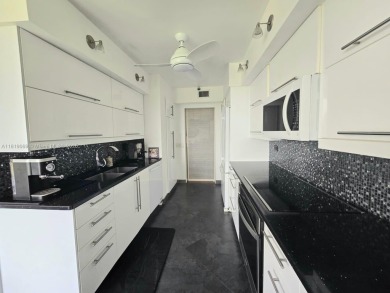 Live in elegance in this beautifully remodeled home in a gated on Inverrary Country Club in Florida - for sale on GolfHomes.com, golf home, golf lot
