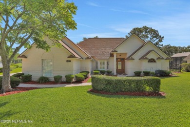 ''Sandwedged'' between the 11th and 12th holes, this Country on Jacksonville Golf and Country Club in Florida - for sale on GolfHomes.com, golf home, golf lot