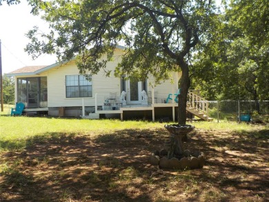 LIGHT AND BRIGHT, CUTE COZY CRAFTMAN STYLE HOME ON TWO LOTS on Nocona Hills Golf Course in Texas - for sale on GolfHomes.com, golf home, golf lot