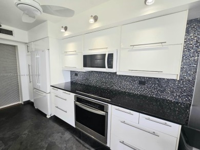Live in elegance in this beautifully remodeled home in a gated on Inverrary Country Club in Florida - for sale on GolfHomes.com, golf home, golf lot