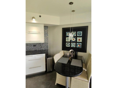 Live in elegance in this beautifully remodeled home in a gated on Inverrary Country Club in Florida - for sale on GolfHomes.com, golf home, golf lot