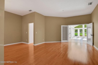 ''Sandwedged'' between the 11th and 12th holes, this Country on Jacksonville Golf and Country Club in Florida - for sale on GolfHomes.com, golf home, golf lot
