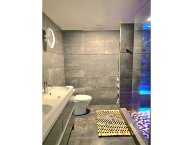 Live in elegance in this beautifully remodeled home in a gated on Inverrary Country Club in Florida - for sale on GolfHomes.com, golf home, golf lot