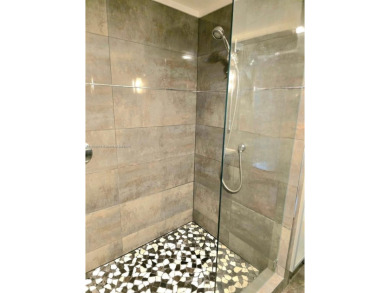 Live in elegance in this beautifully remodeled home in a gated on Inverrary Country Club in Florida - for sale on GolfHomes.com, golf home, golf lot