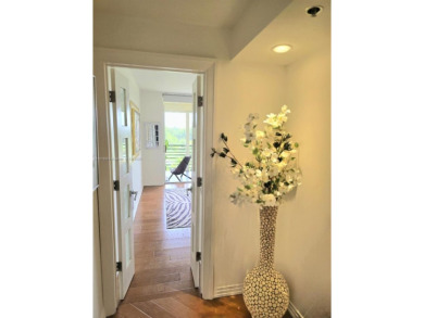 Live in elegance in this beautifully remodeled home in a gated on Inverrary Country Club in Florida - for sale on GolfHomes.com, golf home, golf lot