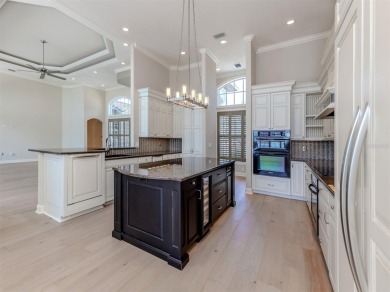 One or more photo(s) has been virtually staged. Waterfront on Bird Bay Executive Golf Club in Florida - for sale on GolfHomes.com, golf home, golf lot