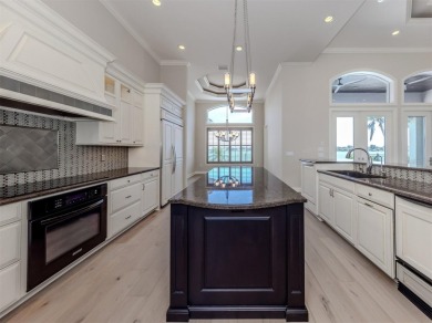 One or more photo(s) has been virtually staged. Waterfront on Bird Bay Executive Golf Club in Florida - for sale on GolfHomes.com, golf home, golf lot