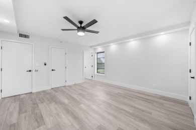 Step into luxury in this fully remodeled 2-bed, 2-bath corner on Marina Lakes Golf Course in Florida - for sale on GolfHomes.com, golf home, golf lot